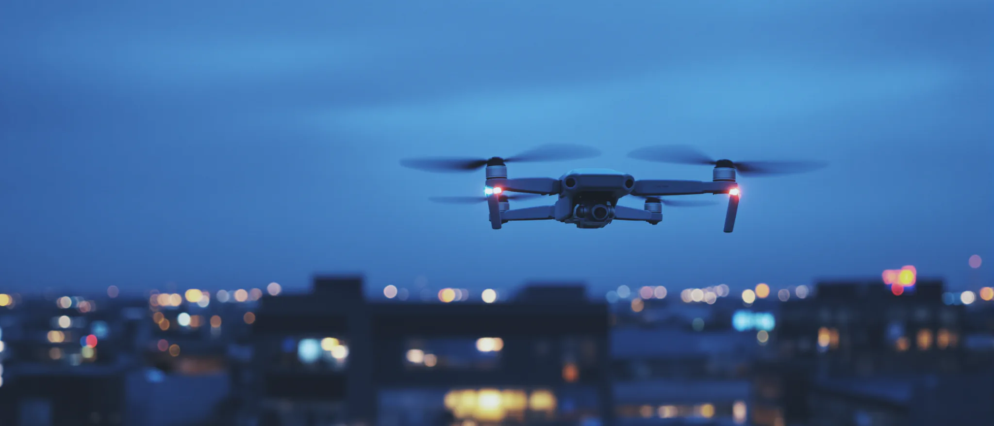 A Sentinel drone lifting off at dusk for an overnight patrol sweep.